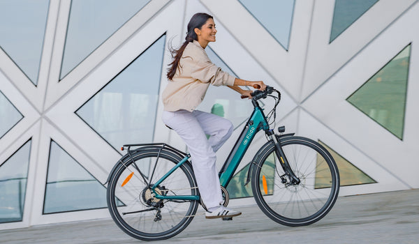 A woman riding a Fiido C11 Pro electric bike