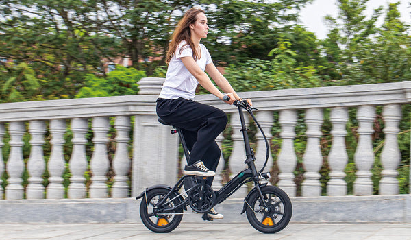 Woman riding Fiido M1pro electric bike on bridge