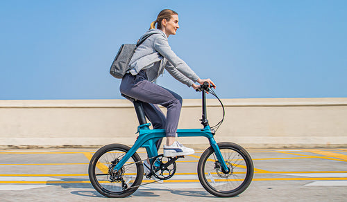 Woman rides Fiido X electric bike on the street