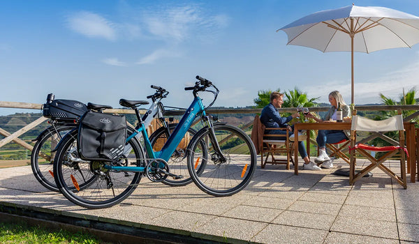 Man and woman resting next to Fiido C11 electric bicycles