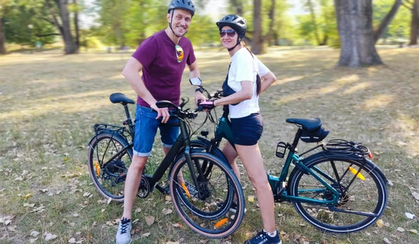 A couple is exercising while riding Fiido’s lightweight electric bikes.