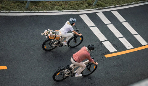 Both people are riding Fiido Nomads long-range electric bikes.