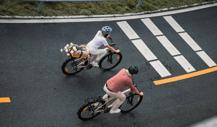 Both people are riding Fiido Nomads long-range electric bikes.