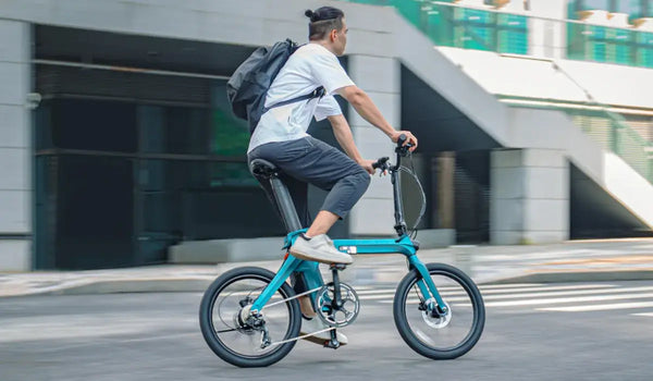A man commutes to work on a Fiido X foldable electric bicycle.