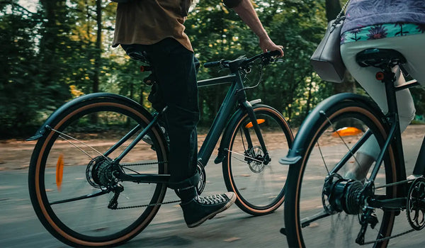 A couple enjoys a ride on Fiido electric bikess.