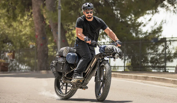 A man rides a Fiido Titan electric bicycle.