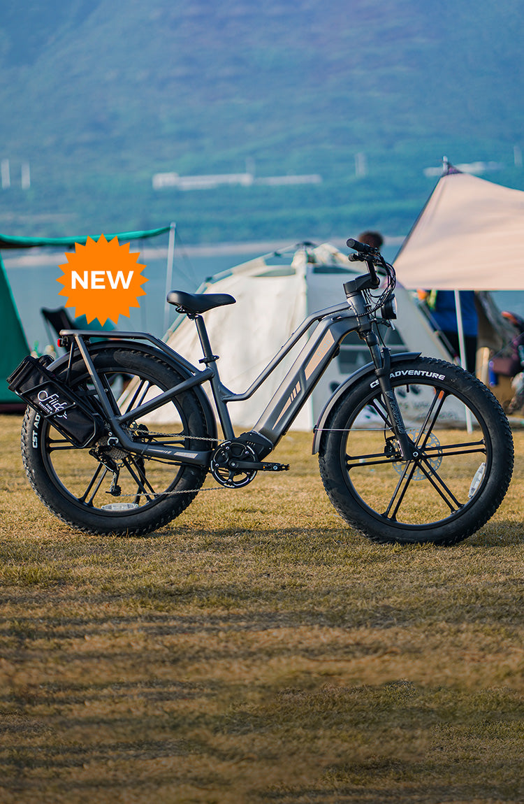 A Fiido Titan electric bike parked next to a tent.