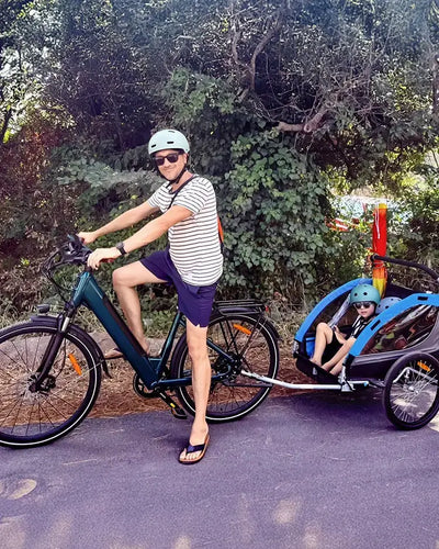 User Christian Wohlgemuth rides a Fiido C11 Pro electric bike, taking a child out for a ride.