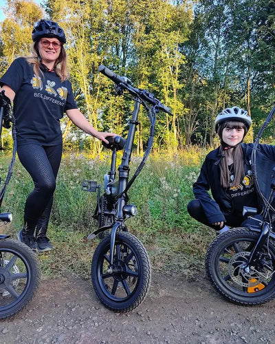 User BitzyBobzy and her sister ride a Fiido D3 Pro on a country road.