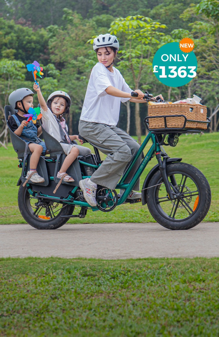 A woman rides a Fiido T2 electric bike with two kids, who are holding pinwheels.